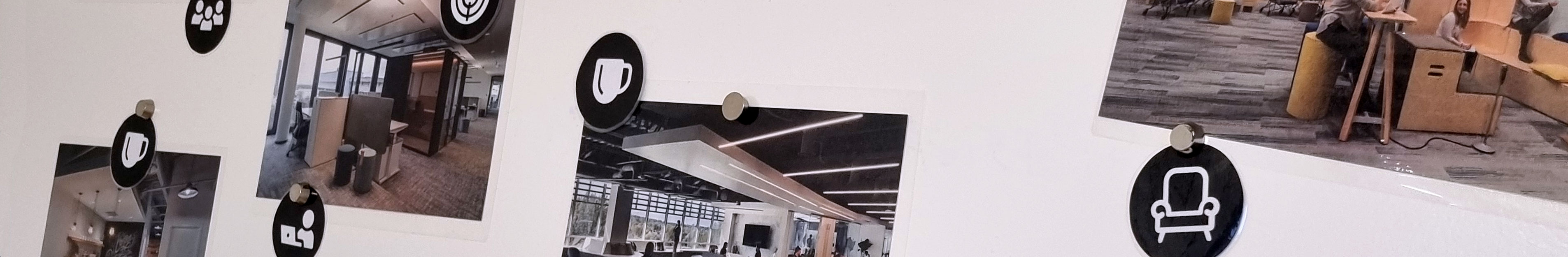 Whiteboardwand mit Bildern von verschiedenen Zonen im Büro