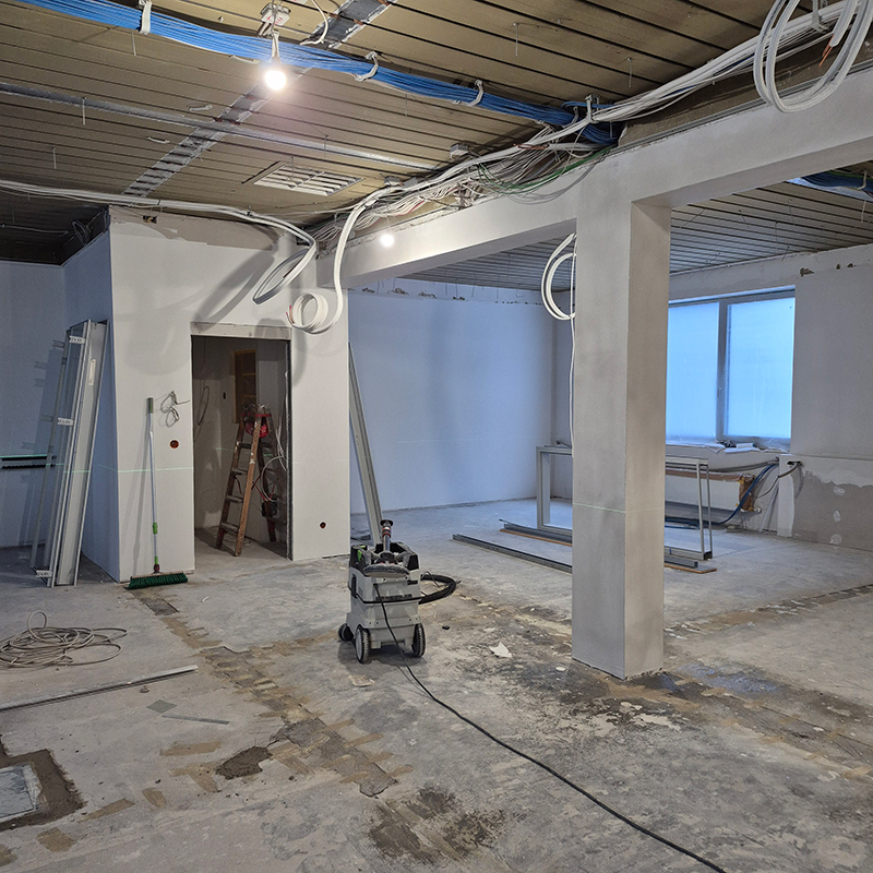 Office space during construction phase showing exposed structure and ongoing fit-out works.
