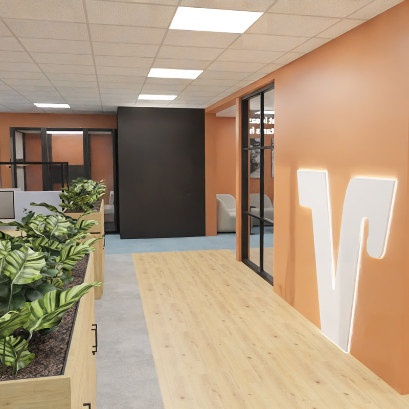 Newly designed office area with branding elements, integrated greenery, and modern materials.